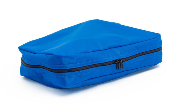A filled and zipped closed Island (blue) Aether End Pocket Aeronaut 45 Packing Cube.
